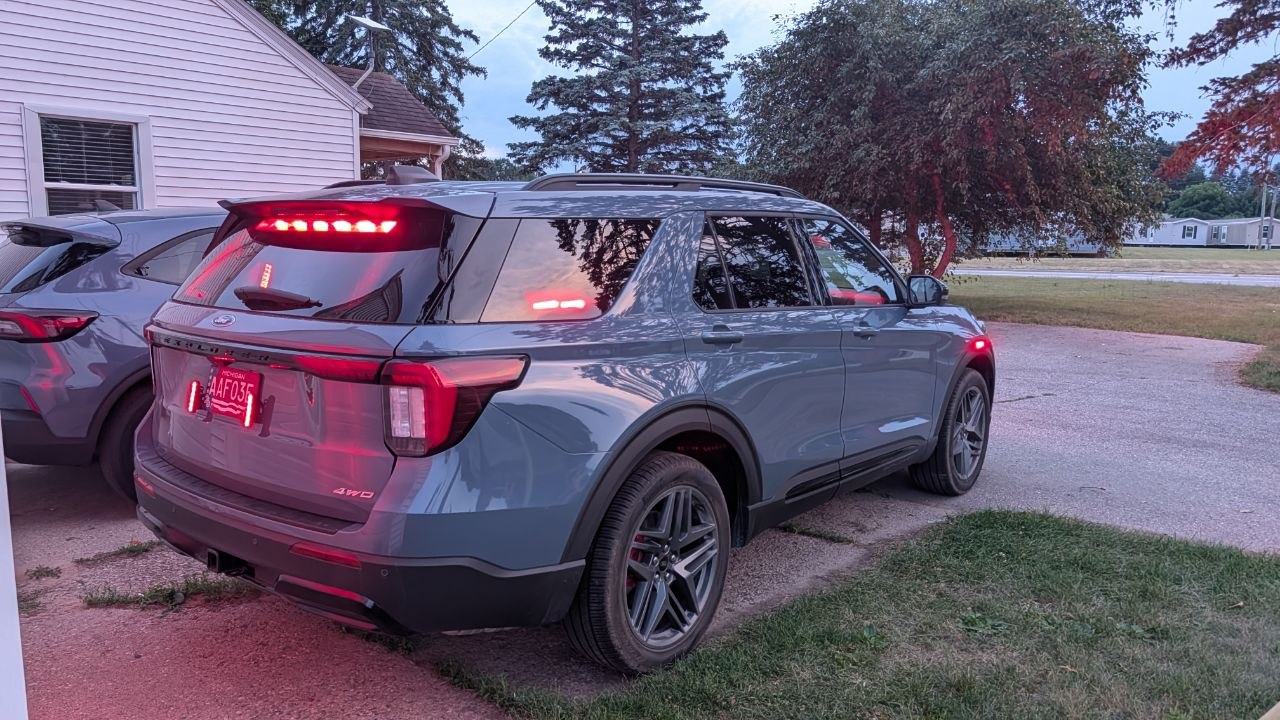 Rear view of Ford Explorer upfitted by Fera Comm showing rear and side emergency warning lighting